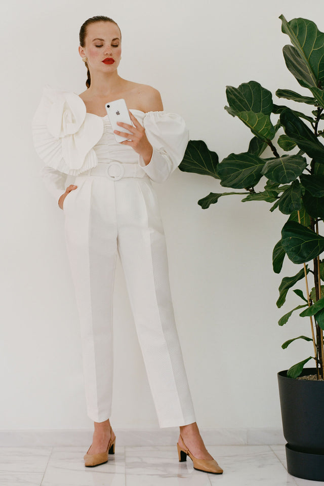Model in milky-white 3d cotton off-shoulder top front view