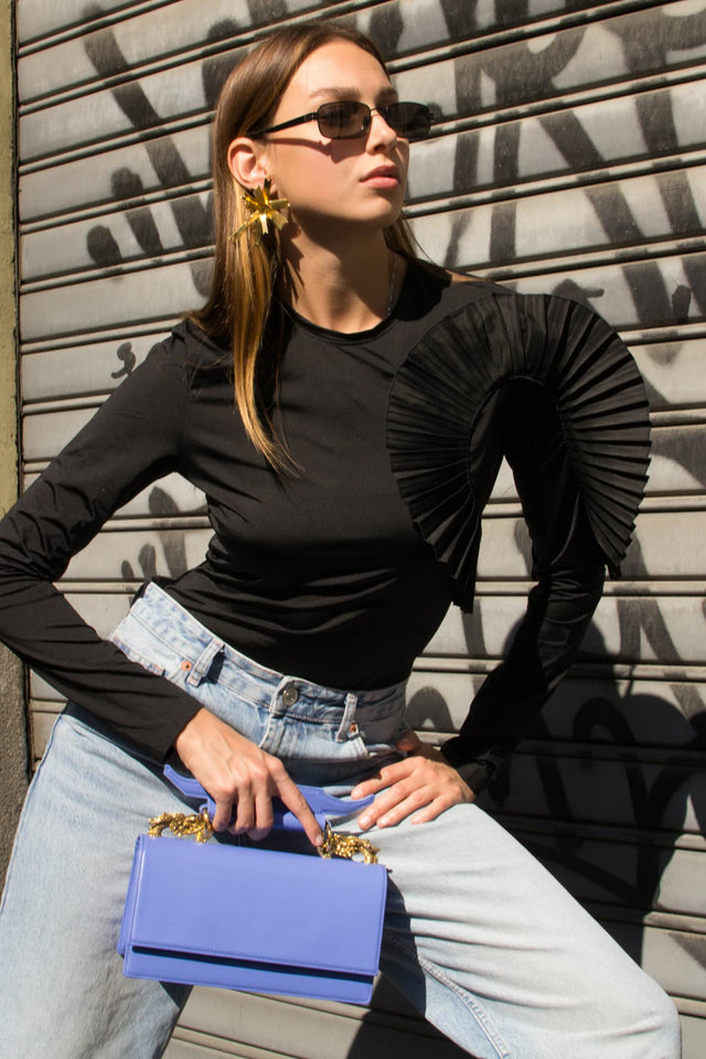 Model in long sleeve ruffle bodysuit