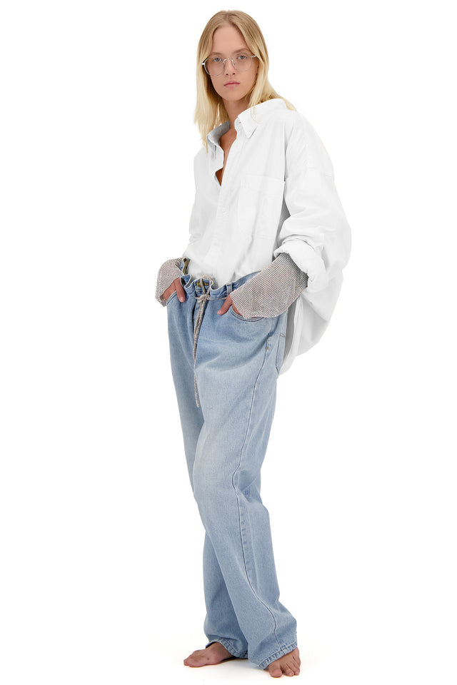 Model in white Redesignet sleeve shirt