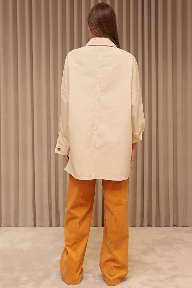 Model in ivory Denim shirt back view