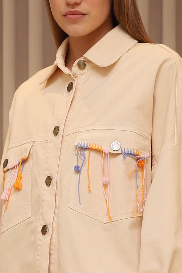 Model in ivory Denim shirt detail