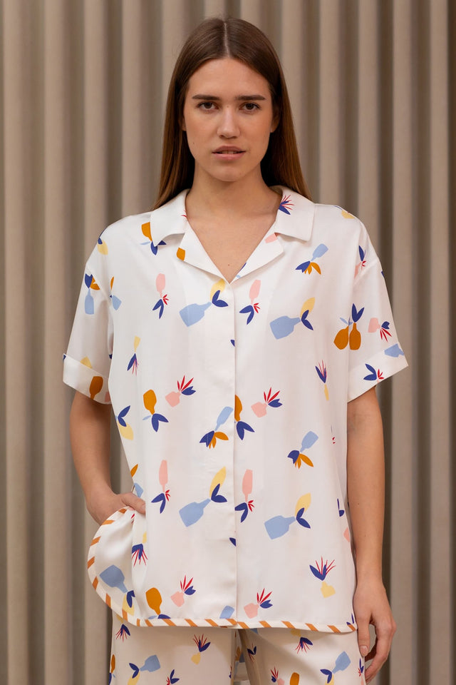 Model in Hawaiian shirt jugs front view