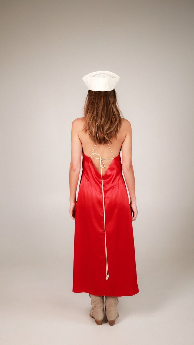 Dress with an open back and a decorative belt