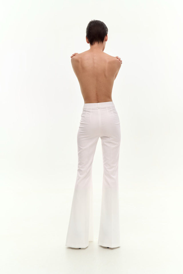 FLARE PANTS WITH CRYSTAL FASTENING.