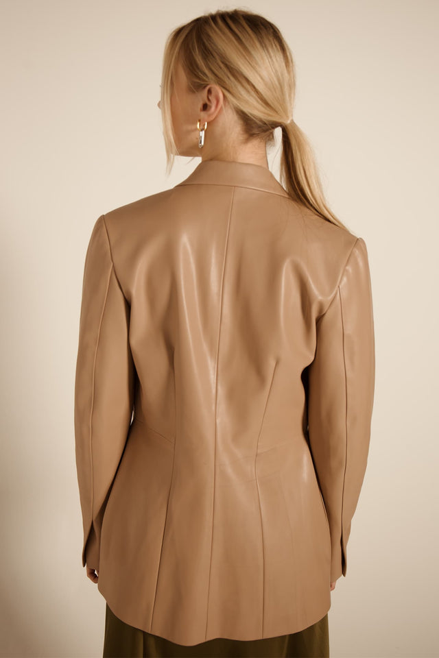 Model in beige Fitted jacket back view