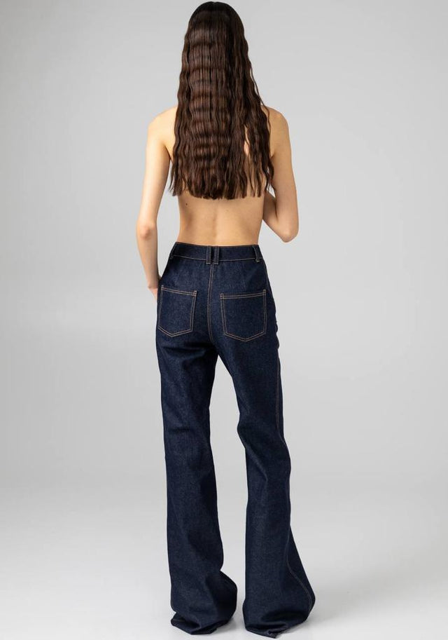Model in dark blu Trousers GUDU back view