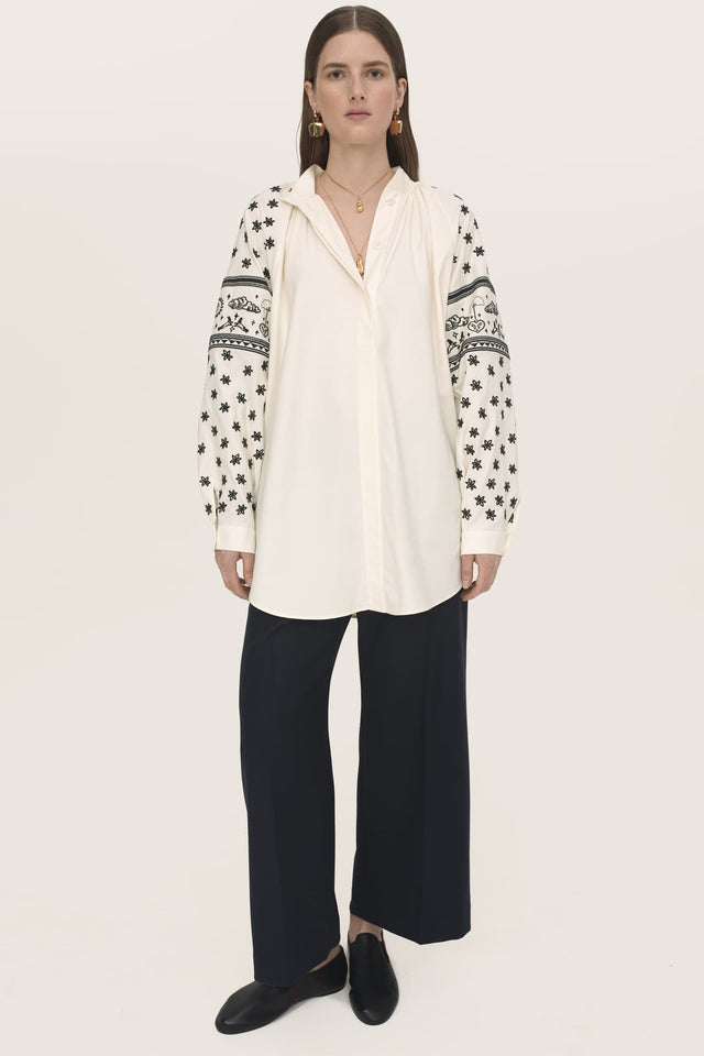 Model in white Franka embroidered shirt front view
