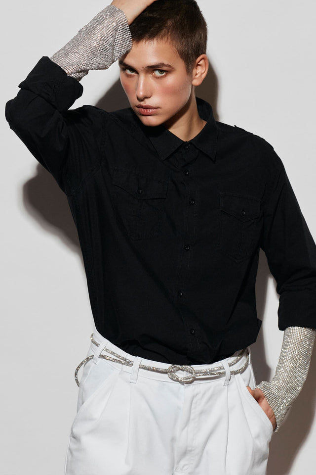 Model in white Redesignet sleeve shirt