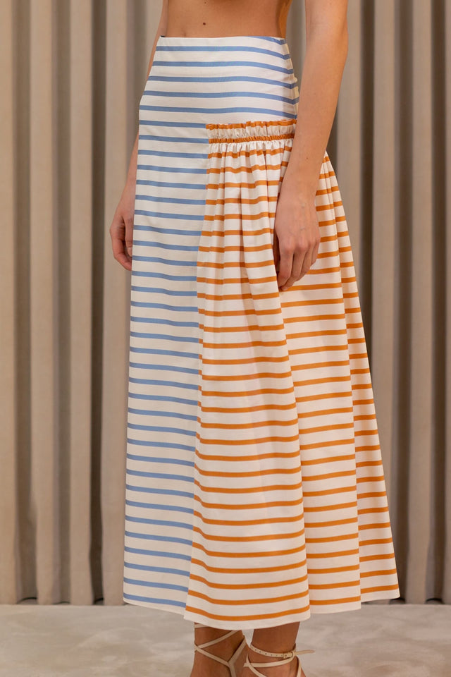 Model in Striped gathered skirt side view
